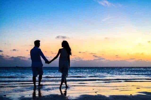 How to Attract Love Could walking on beach at sunset