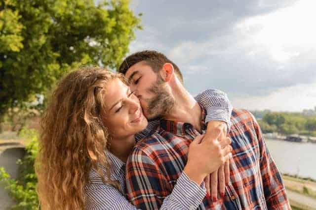 Daily Affirmations for Love couple hugging in countryside