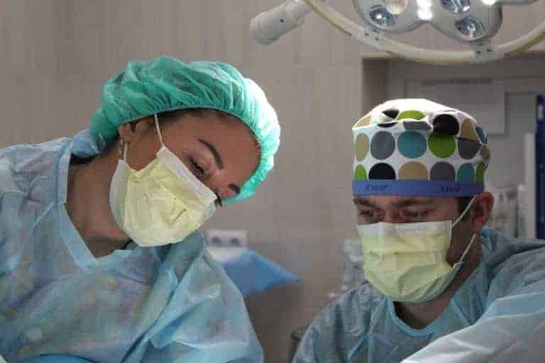 Man and women surgeon in operating room