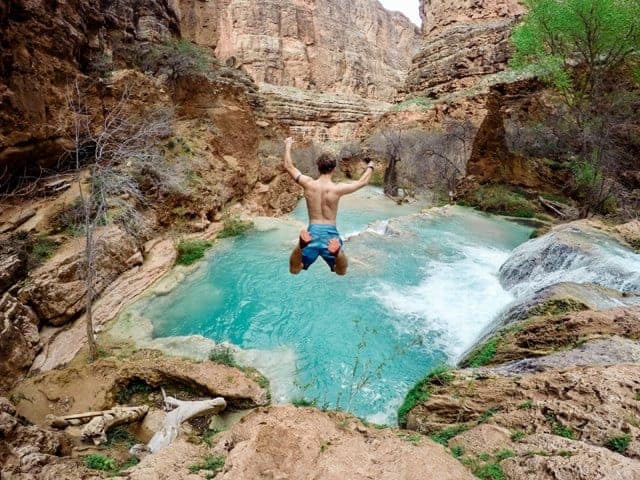 Life Path Number five Man Jumping into waters for adventure