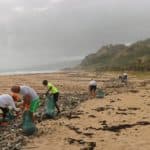 Volunteers Cleaning up a Beach Coast