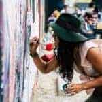 Life Path number three women painting a mural in street